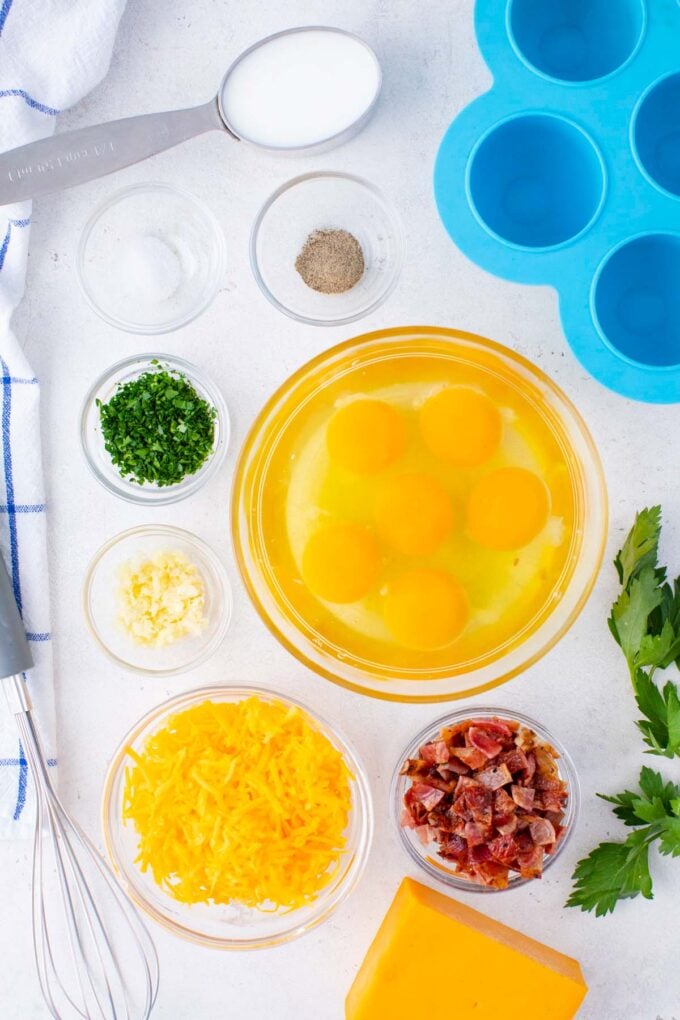 Overhead shot of Instant Pot egg bites ingredients in bowls on a table.
