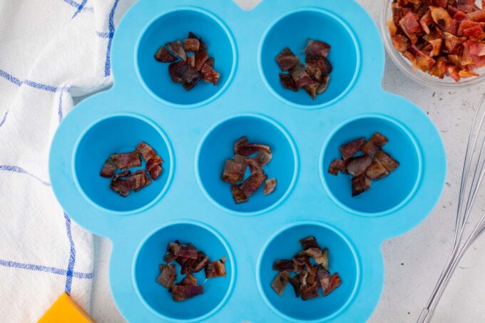 Bacon bites on the bottom of a silicone egg mold.