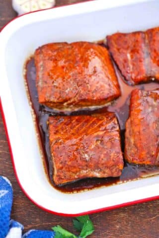 baked maple syrup salmon fillets in a baking dish