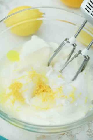adding lemon zest to cream cheese mixture
