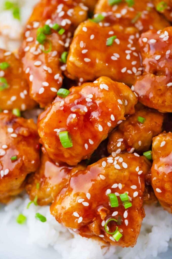 Korean fried chicken pieces on top of white rice