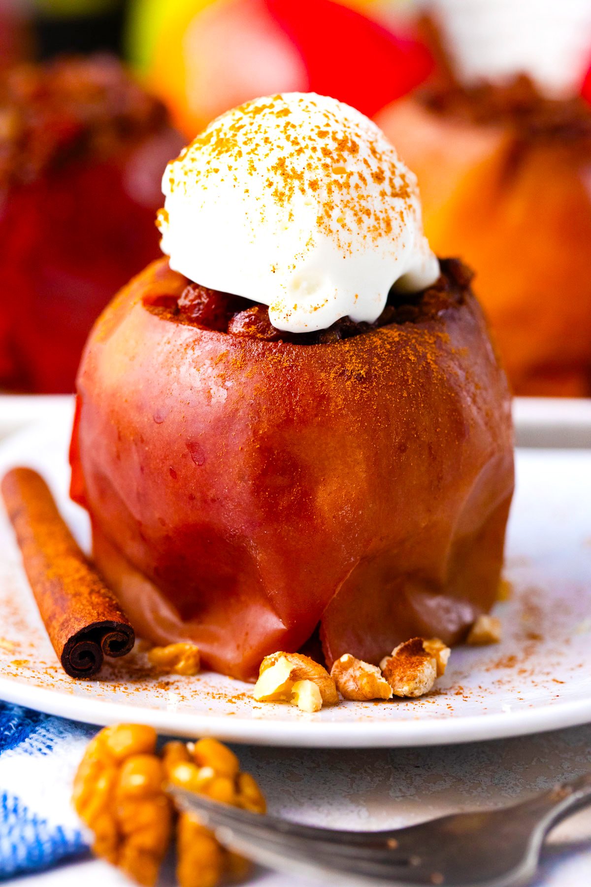 Instant Pot baked apple topped with ice cream and cinnamon.