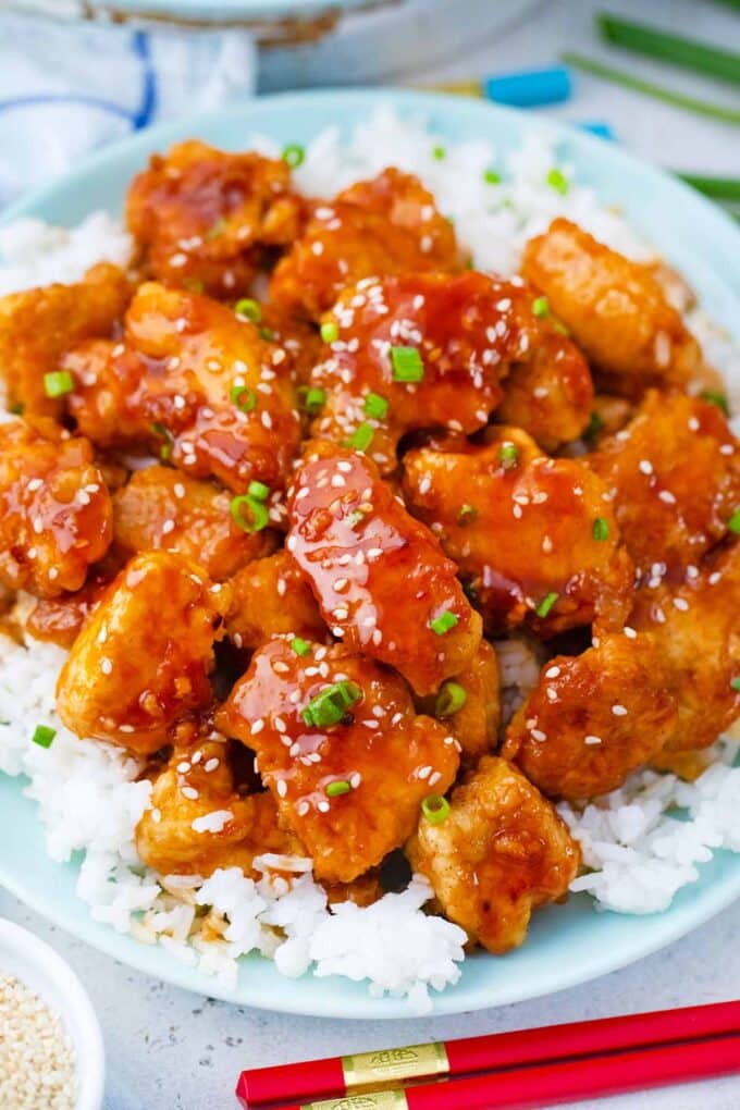 homemade Korean fried chicken pieces on top of white rice