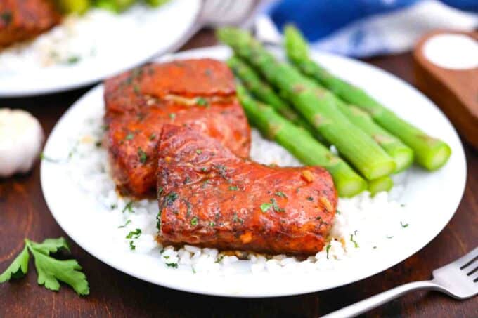 maple syrup salmon fillets served over rice and asparagus