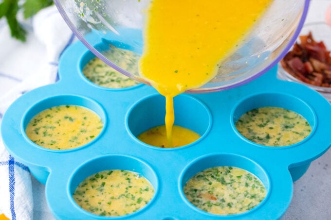 Pouring egg mixture onto an egg mold.