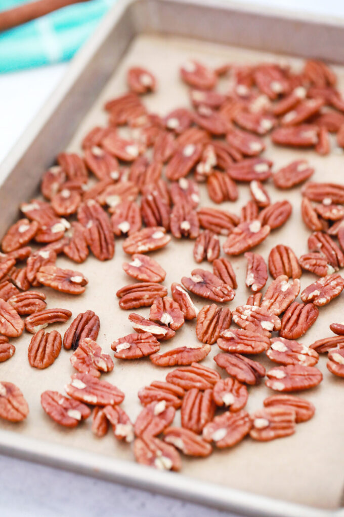 Pecans on a cookie sheet.