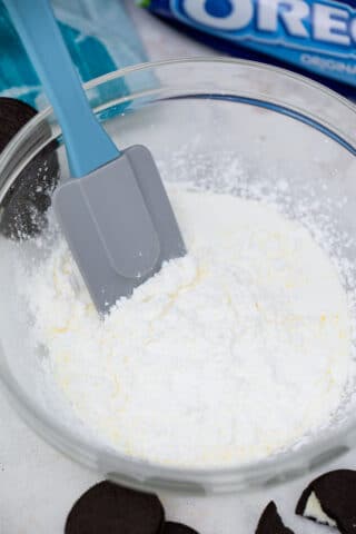 mixing whipped cream and cream cheese