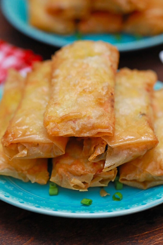 Panda Express chicken egg rolls stacked on a plate.
