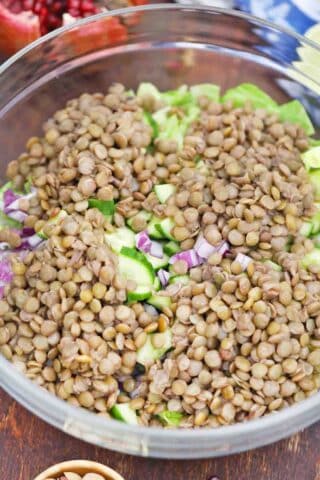 adding cooked lentils to a salad