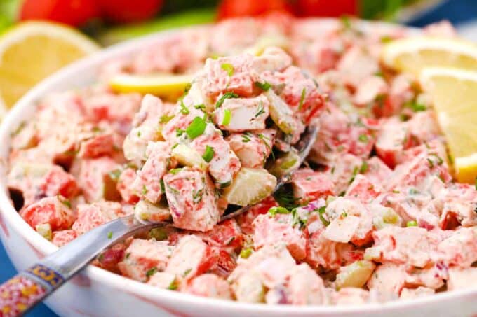 a large bowl of homemade crab salad with imitation crab