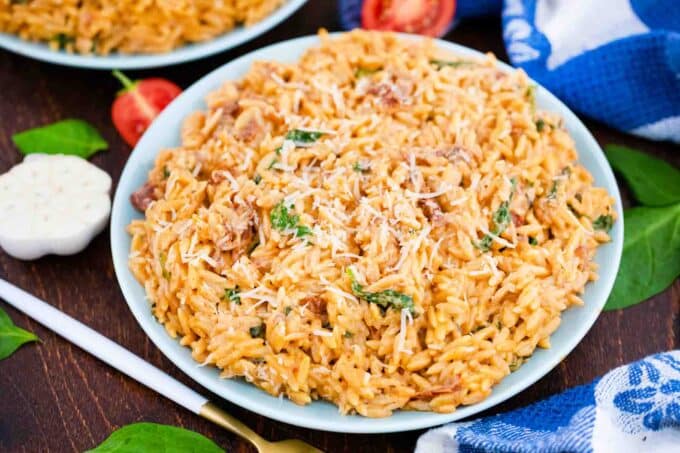 a plate of creamy tuscan orzo