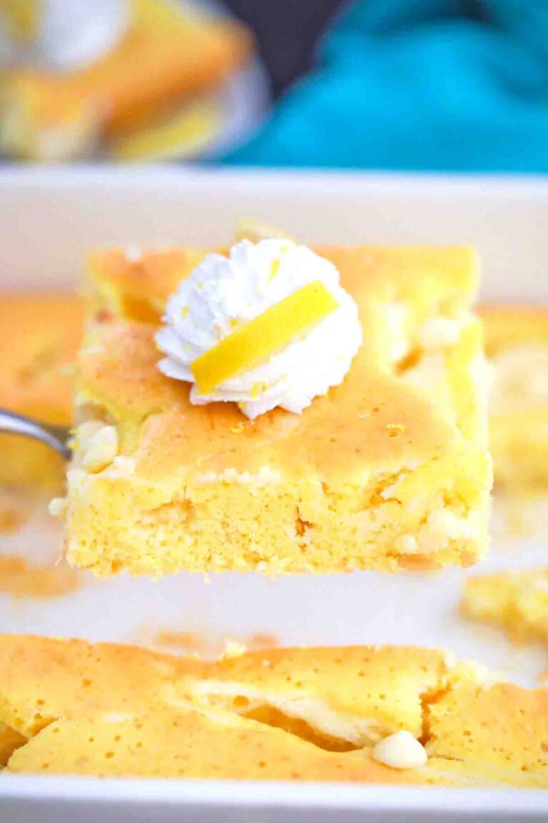 lifting a slice of lemon earthquake cake on a spatula