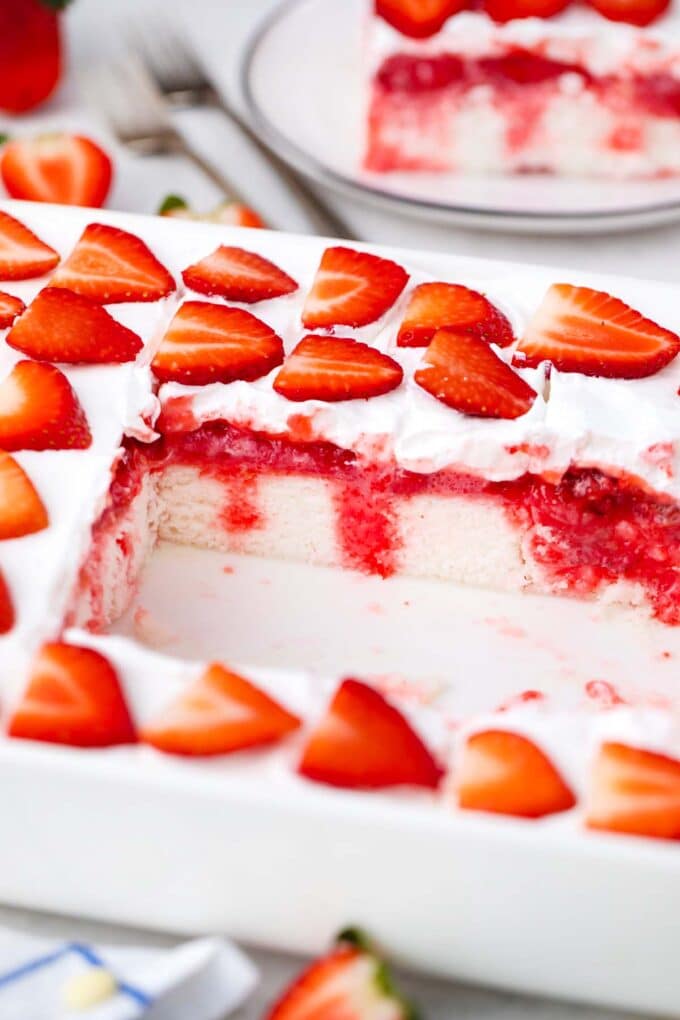 strawberry poke cake in a pan