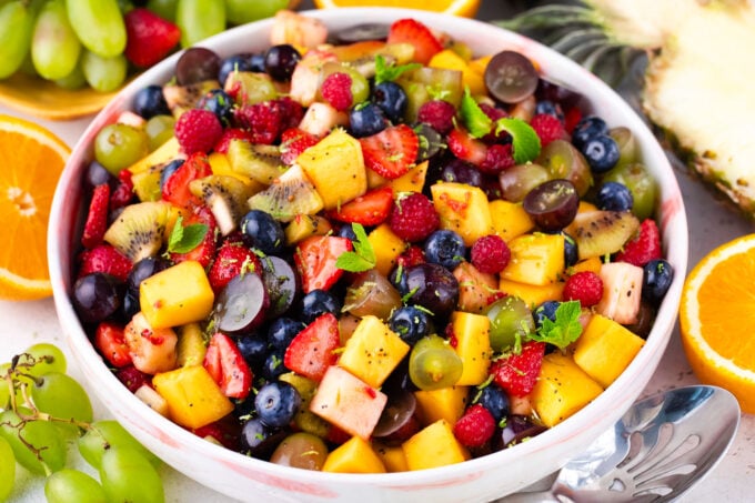 Homemade fruit salad with mango and berries.