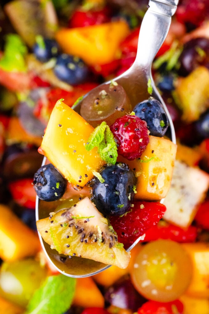 A spoonful of fruit salad.