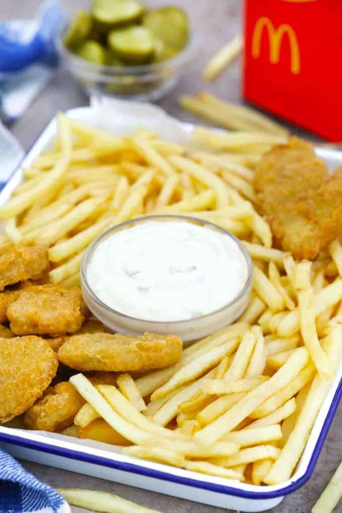 homemade McDonald's tartar sauce served on a tray with fries and nuggets