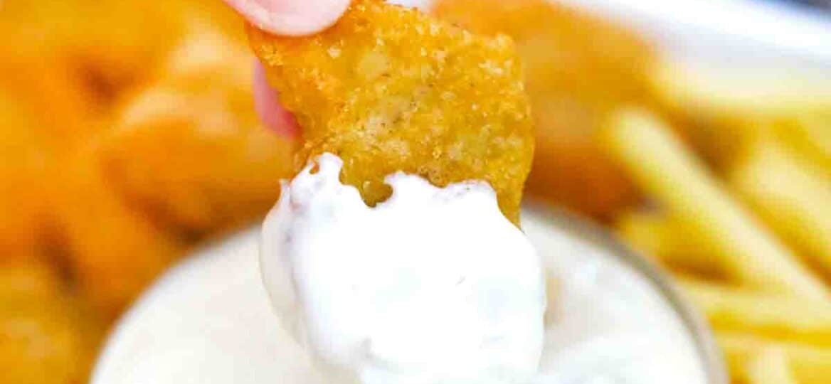 dipping a chicken nugget in homemade McDonald's tartar sauce