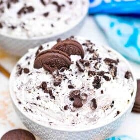 a bowl of homemade oreo fluff topped with oreo cookies