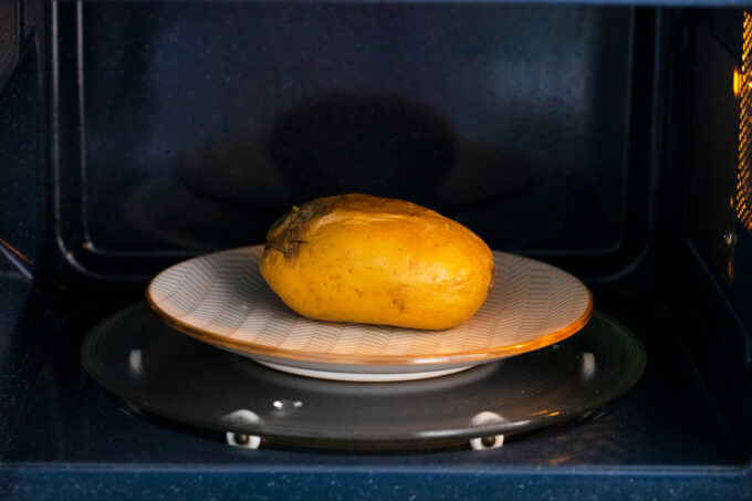Microwaving a potato.