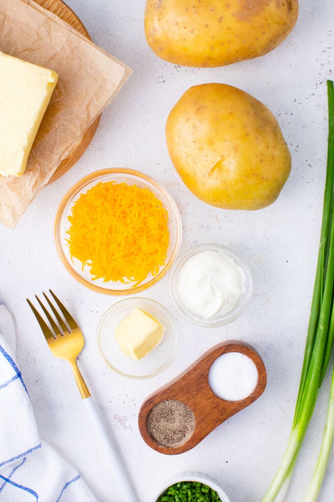 Overhead shot of ingredients used in how to microwave a potato recipe.