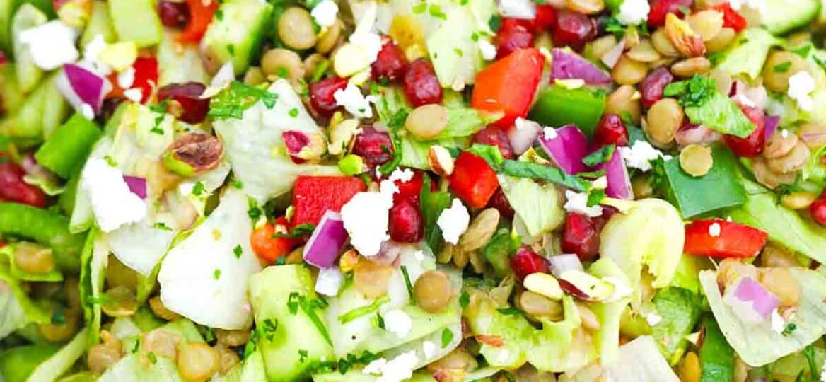 overhead shot of a bowl of chopped mediterranean lentil salad recipe