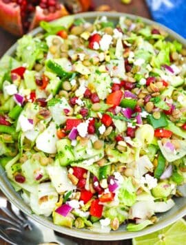 overhead shot of a bowl of chopped mediterranean lentil salad recipe