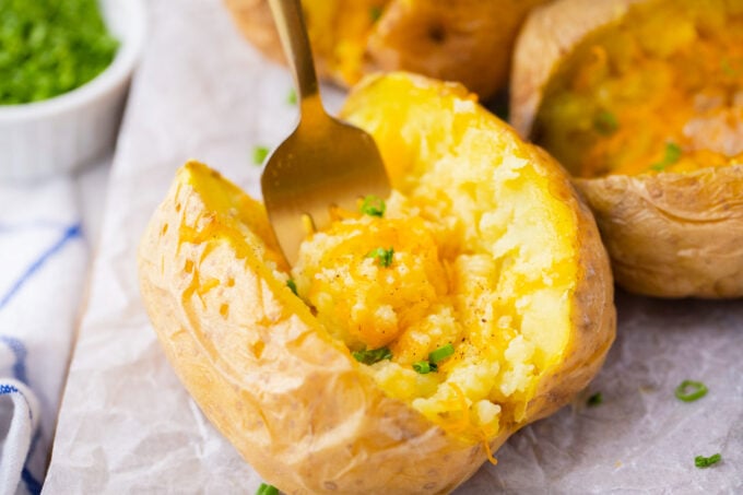 Cheesy microwaved potato.