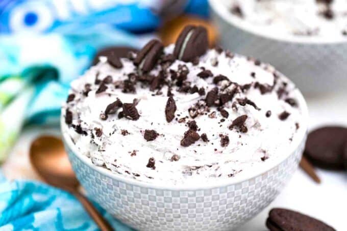 a bowl of fluffy and creamy oreo fluff topped with Oreos