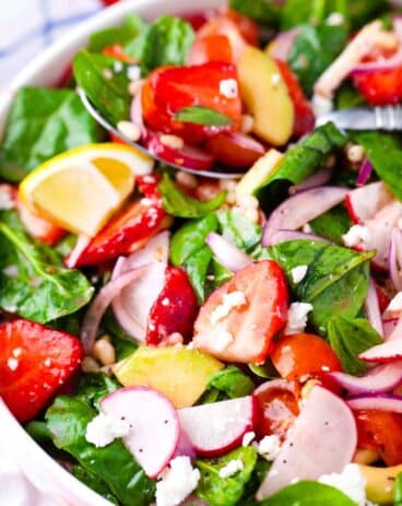 strawberry spinach salad with red onion and radishes