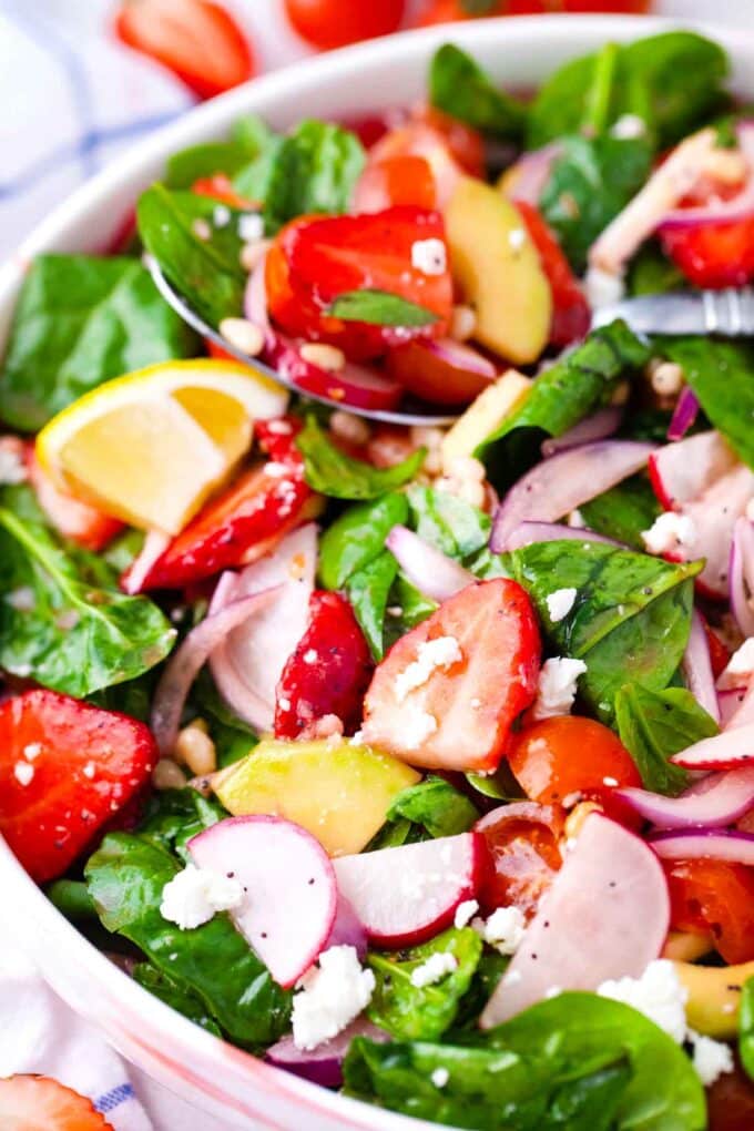 strawberry spinach salad with red onion and radishes