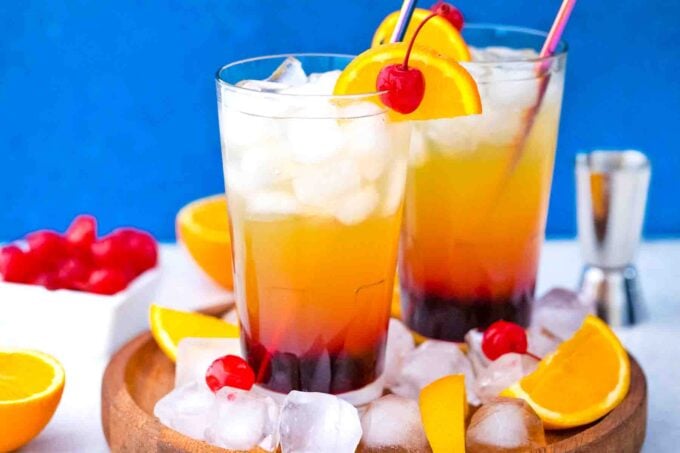 tequila sunrise cocktails serve with orange slices and maraschino cherries
