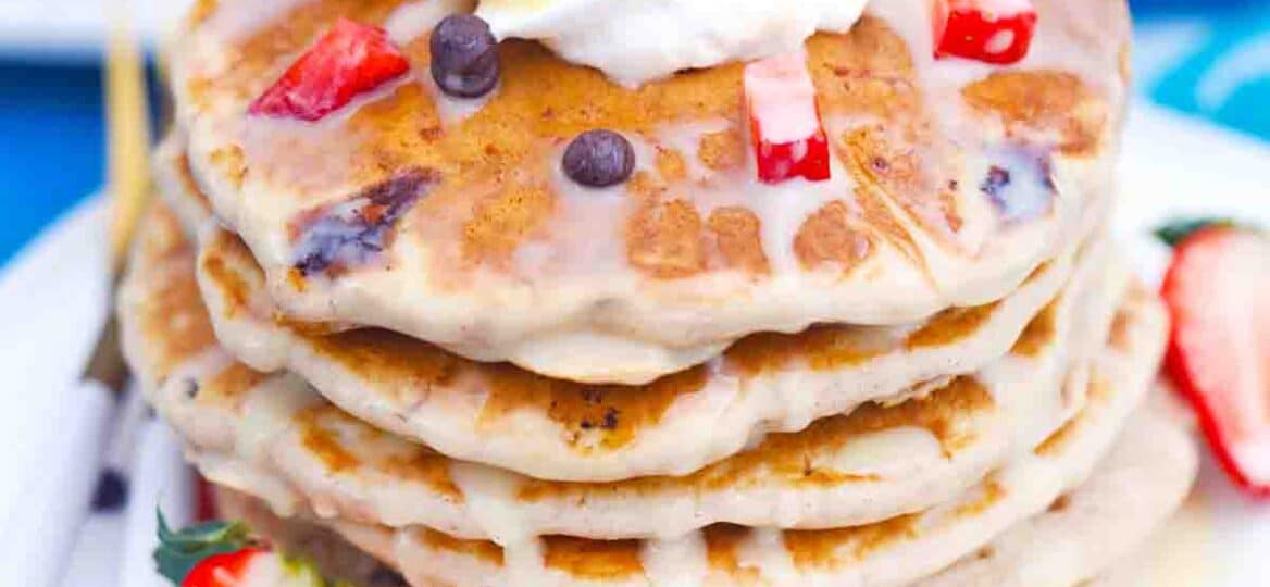 stack of tres leches pancakes drizzled with tres leches sauce