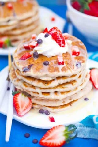 stack of tres leches pancakes drizzled with tres leches sauce