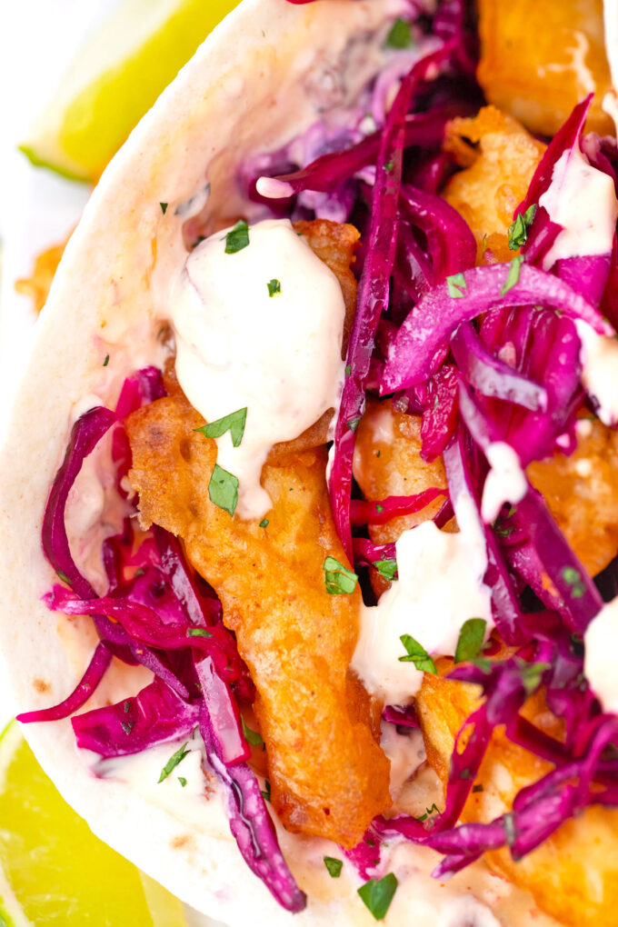 Baja fish tacos with crunchy purple cabbage slaw and creamy Chipotle aioli.