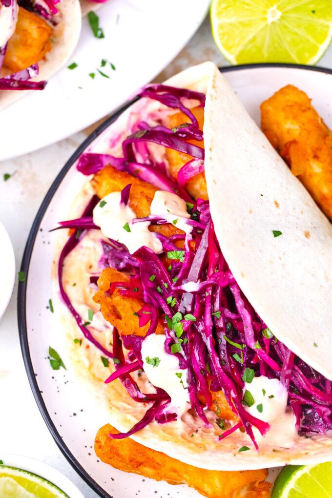 Homemade crispy Baja fish tacos with slaw and Chipotle sauce.