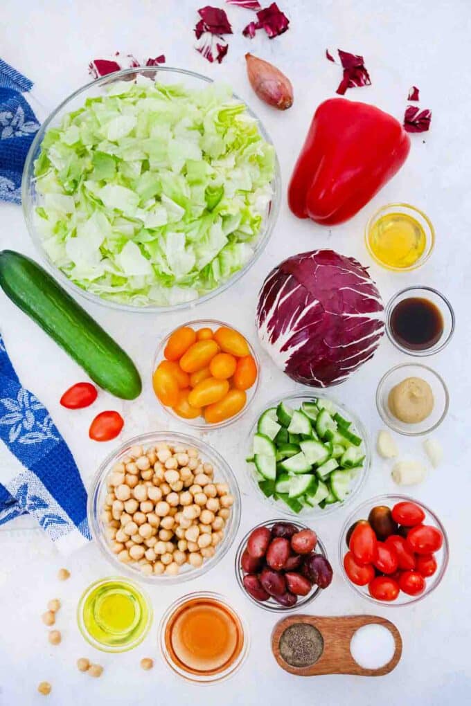 overhead shot of ingredients for chopped mediterranean salad on a table