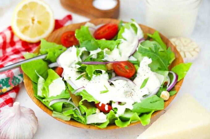 a salad with creamy parmesan dressing
