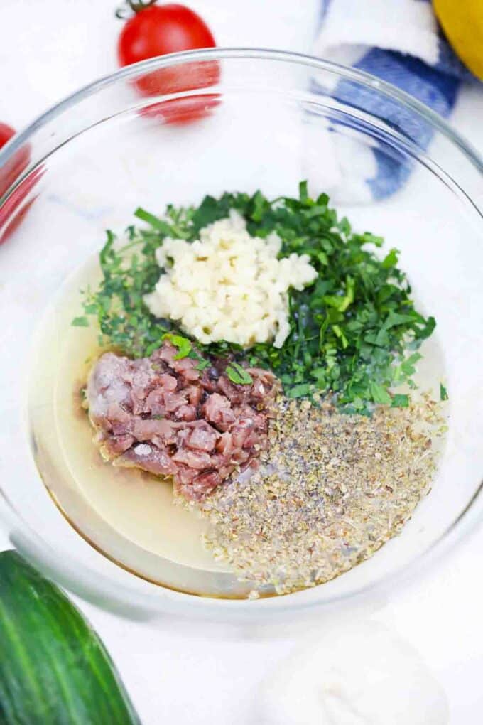 Greek salad dressing ingredients in a bowl
