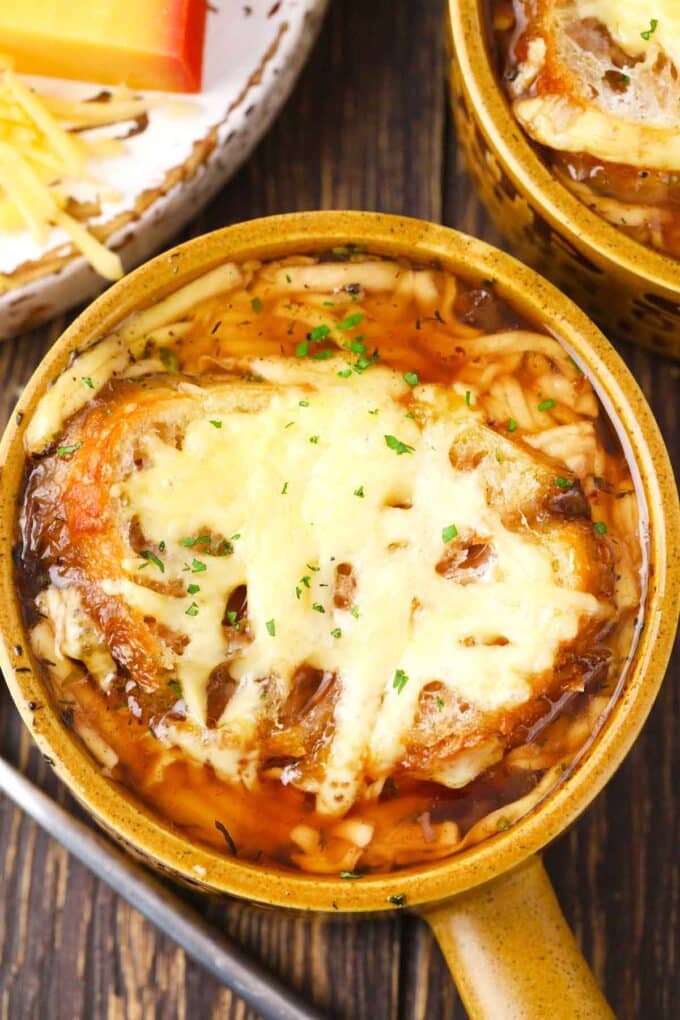 overhead shot of instant pot french onion soup topped with french bread and melted cheese