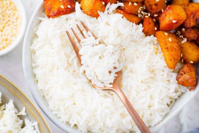 White rice made in the Instant Pot served with sweet potatoes.