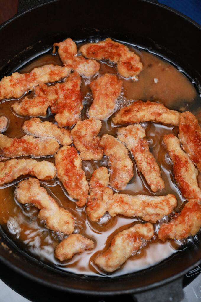 Frying chicken pieces.