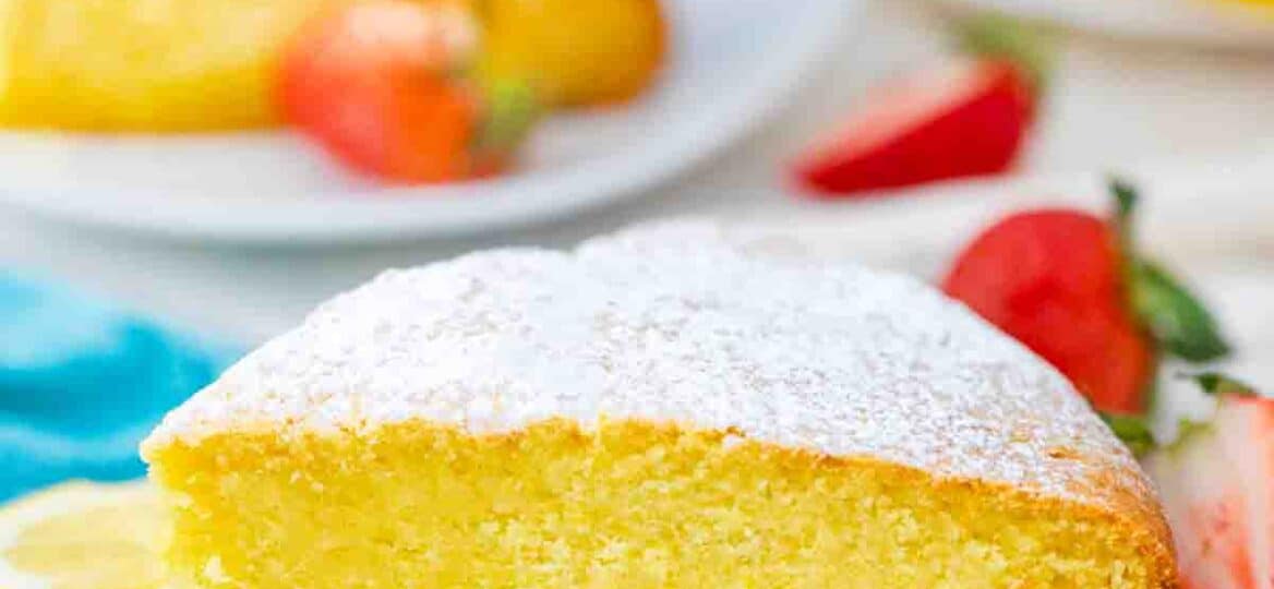 a slice of lemon ricotta cake topped with powdered sugar