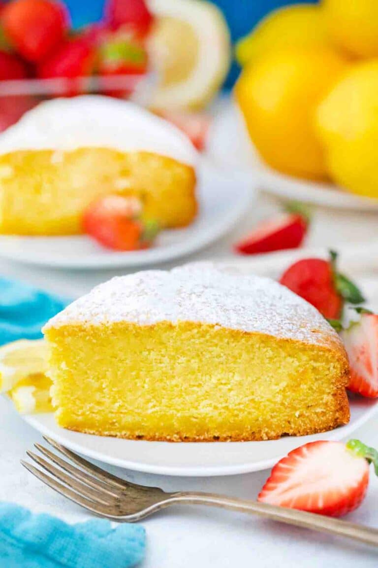 a slice of lemon ricotta cake topped with powdered sugar