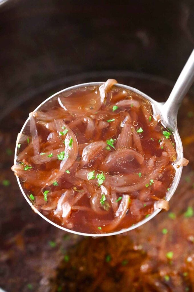 a ladle of instant pot french onion soup