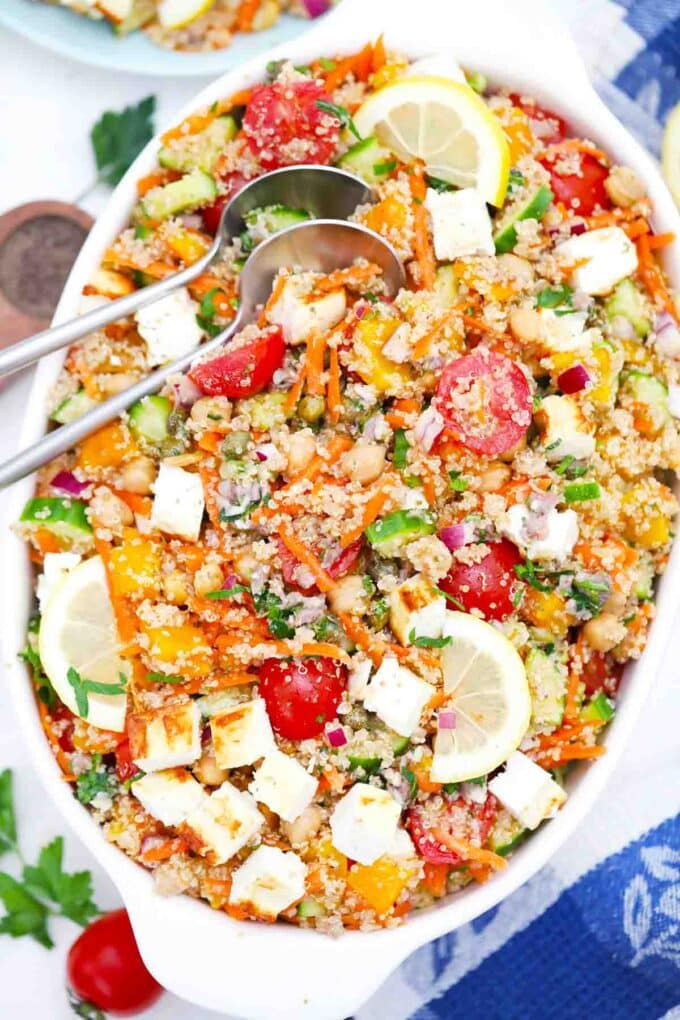 overhead shot of mediterranean grilled feta quinoa salad in a large serving bowl