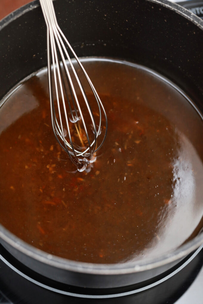 Making homemade honey sesame sauce.