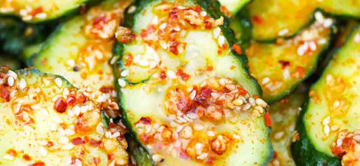 close macro shot of cucumber salad with red pepper flakes