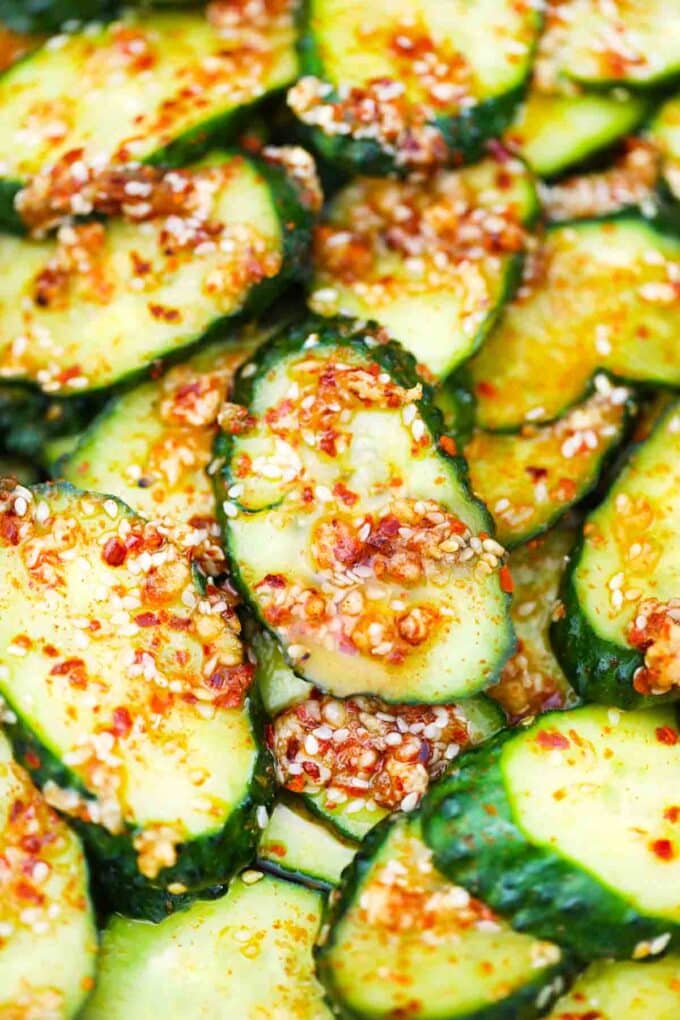 close macro shot of cucumber salad with red pepper flakes