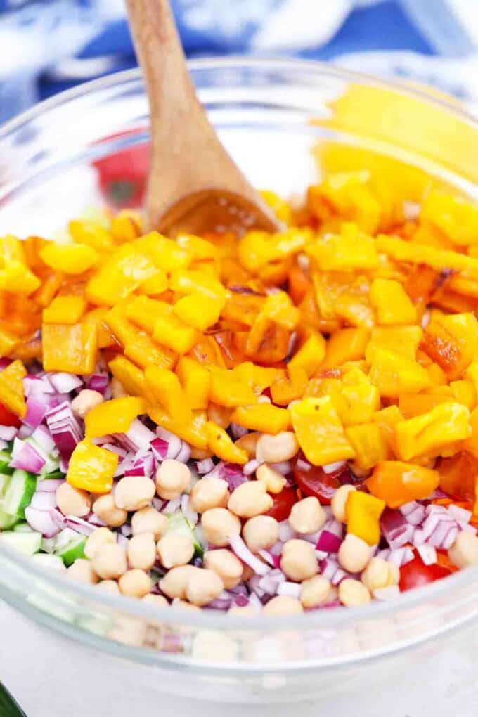 mixing veggies in a bowl