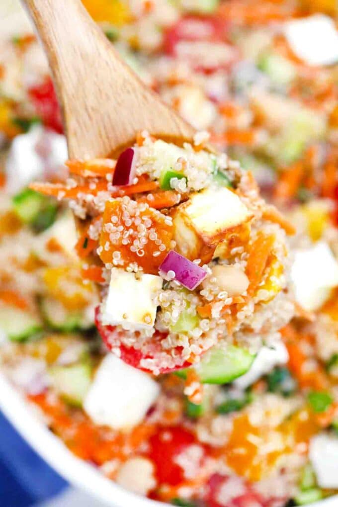 a large spoonful of mediterranean grilled feta quinoa salad